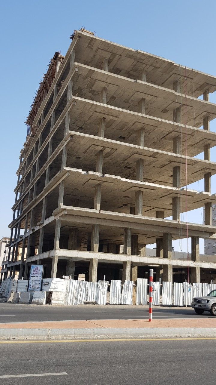 Construction workers building houses at a site in Jaipur – Best Construction Company in Jaipur